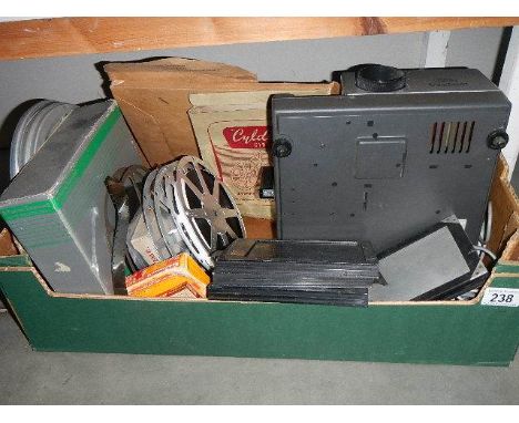 A projector, film reels etc.,