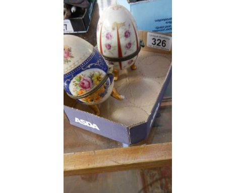 2 egg shaped trinket boxes.