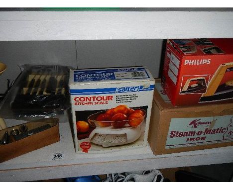 A shelf of assorted kitchen items.