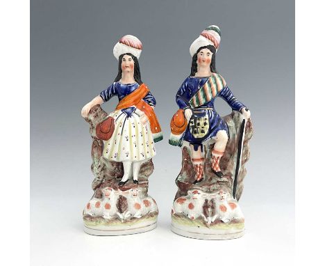 A pair of Staffordshire shepherd and shepherdess figures in Scottish Highland dress, circa 1850, Scottish shepherd figure hol