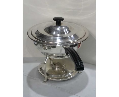 A silver plated chafing dish and stand, circular form with stepped lid and black vinyl handle, the stand with angled supports