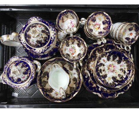 An English porcelain part tea service, possibly Coalport, painted with floral sprays within gilded shaped cartouche, the teap