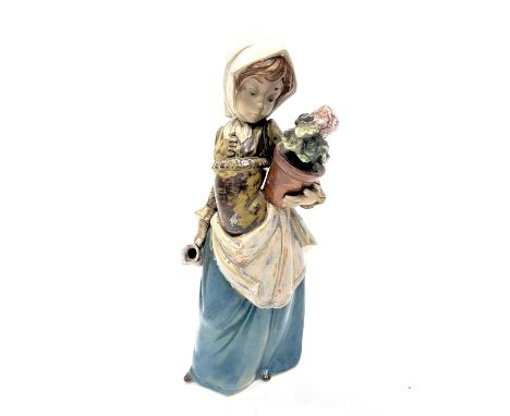 A Lladro figure of a girl holding a potted plant and a pitcher, 33cm high