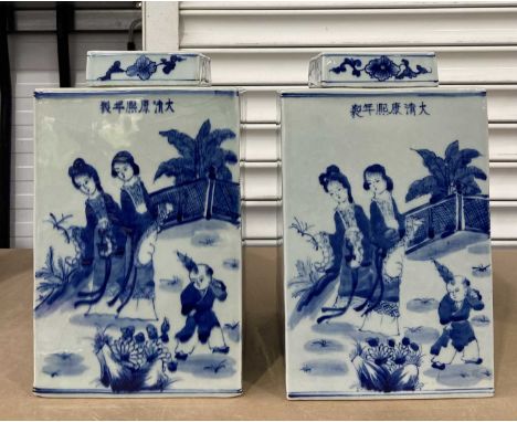 Pair of Chinese Kangxi style blue and white ginger jars and covers, square form, painted figures and landscapes with Chinese 
