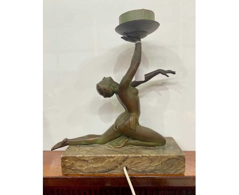 An Art Deco style figural table lamp, modelled in the form of a lady in repose, atop a marble type base, length of base 28.5c
