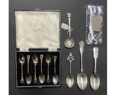 A quantity of silver spoons including hallmarked examples, a cased set with enamel thistle decoration, and, of railway intere