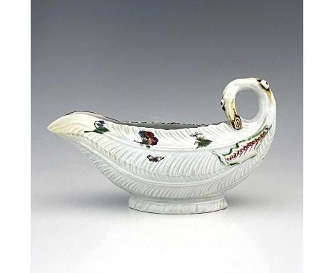 A Worcester cos lettuce leaf moulded sauce boat, workman's mark, circa 1755, realistically modelled and painted with flowers 