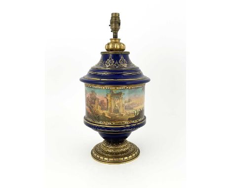 A Paris porcelain table lamp base, late 19th Century, of cylinder form with a stepped conical top and base, the frieze painte