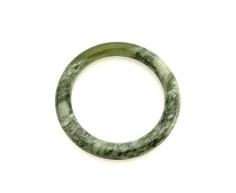 A green hardstone bangle bracelet, boxed