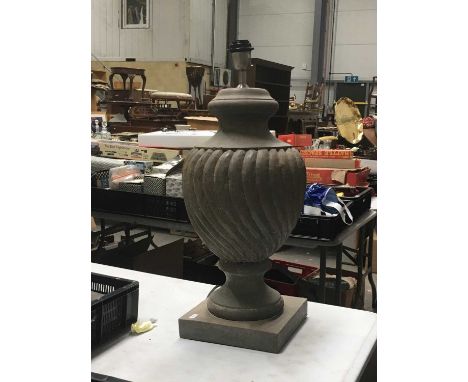A decorative hand turned wooden lamp