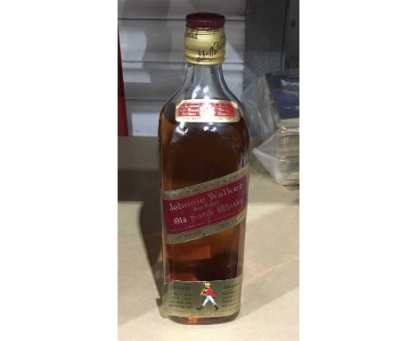 A bottle of Johnnie Walker Scotch whisky.