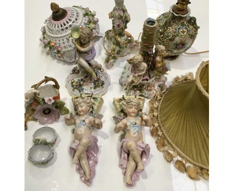 A pair of Conta &amp; Boehme porcelain wall pockets, modelled as putti with grape baskets, together with a collection of Cont