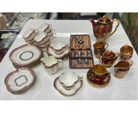 A Coalport tea service together with a Carlton Ware 1950s 'Rouge Royale' Vine pattern coffee service in a deep red and gold c