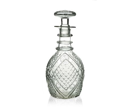 A 19th century American glass decanter, circa 1825, relief moulded Prussian form with diaper hobnail panels and annulated thr