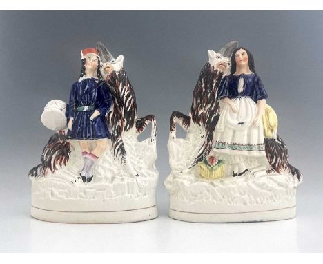 A pair of Staffordshire figures of royal children with goats, circa 1850, figures likely modelled as royal portraits of the P