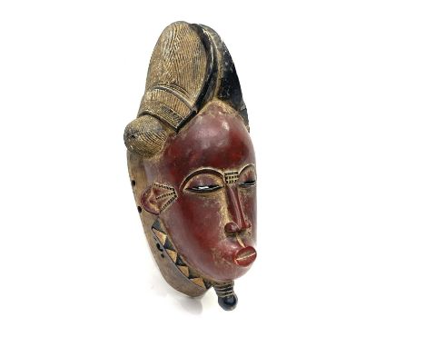 A Baule 'portrait mask', Ivory Coast 46.5 cm tall