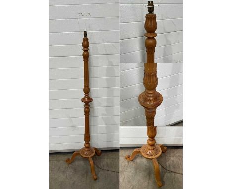A carved wooden lamp W: 48 cm H: 146 cm (excluding socket and lampshade fitting)