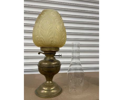 A Victorian brass and amber moulded glass shade oil lamp, Aesthetic Movement style, 43cm high