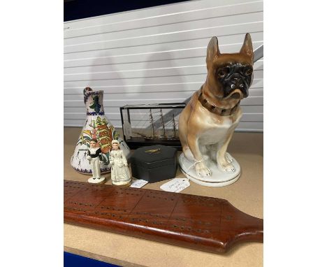 A mixed group including a Lomonosov factory bulldog/boxer figure, c.1970, two early 20th century ceramic communicant figures,