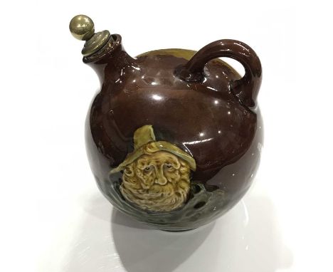 Noke for Royal Doulton, a Kingsware Fisherman flask, globe form with loop handle, brown glazed ground and decorated in low re