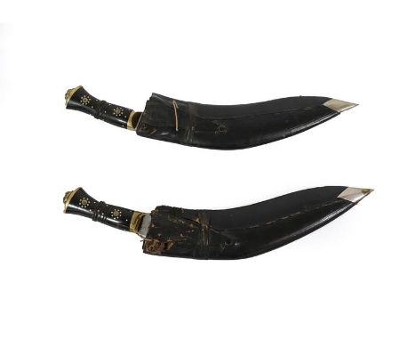 Two Indian Kukris, each with curved blade prick engraved ARMY TRADERS ''SUPER'', with horn grip, brass bolster and lion head 