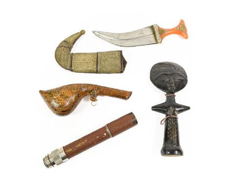 An Arab Jambiya, the curved steel blade with raised medial ridge, waisted amber type grip and filigree decorated leather scab