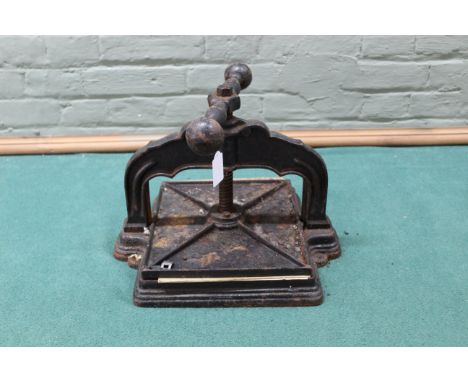 A vintage cast iron book press