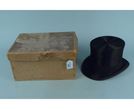 A vintage moleskin top hat with hand brush housed in an Army &amp; Navy card box, hat in good condition (mild signs of use), 