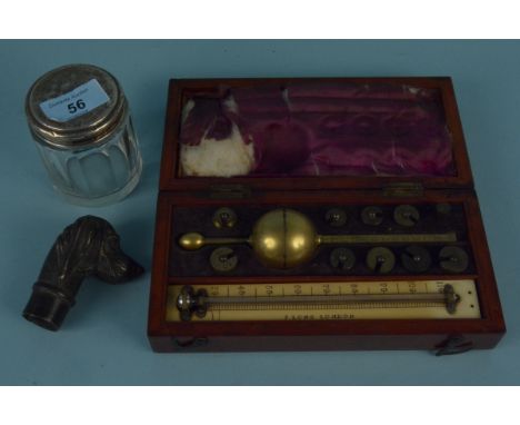A mahogany cased Sikes hydrometer by Joseph Lang London, a brass dogs head walking cane finial plus a silver topped cut glass
