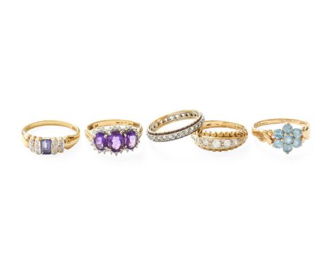 Four 9 Carat Gold Multi-Gem Set Rings, including iolite, blue topaz, amethyst and diamond, etc; and A Colourless Stone Eterni