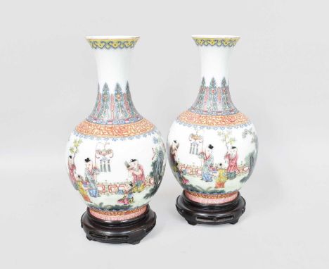 A Pair of Chinese Porcelain Bottle Vases, Jiaqing reign marks but not of the period, painted in famille rose enamels with chi