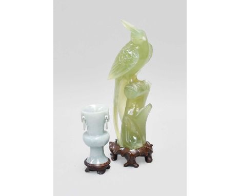 A Chinese Carved Lilac Jade Miniature Vase, of archaistic style with loop handles, 7.5cm on wood stand, together with a simil