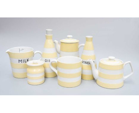 T G Green Cornish Ware, yellow banded, ''Milk'' measuring jug, ''Oil'' and ''Vinegar'' bottles, two ''Salt'' bins, cruet set 