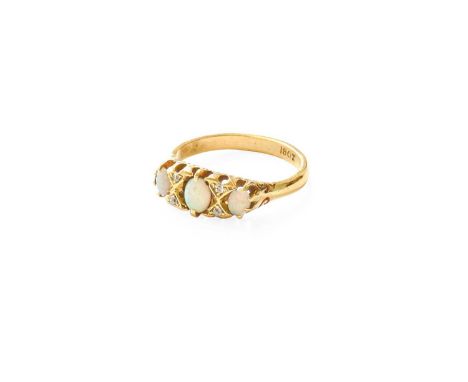An Opal and Diamond Ring, three graduated oval cut opals spaced by pairs of old cut diamonds, in yellow claw settings, to a p