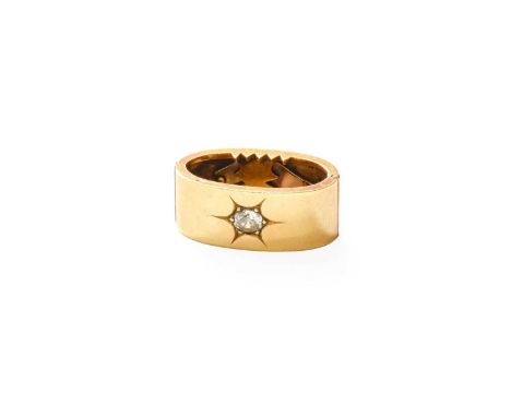 A Diamond Scarf Clip, the old cut diamond in a yellow star setting, to a plain polished surround, estimated diamond weight 0.