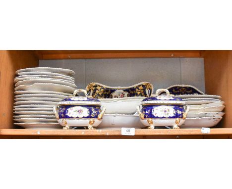 A Derby Porcelain Dessert Service, circa 1820, with cobalt blue and gilt borders, painted with flowers, including a pair of s