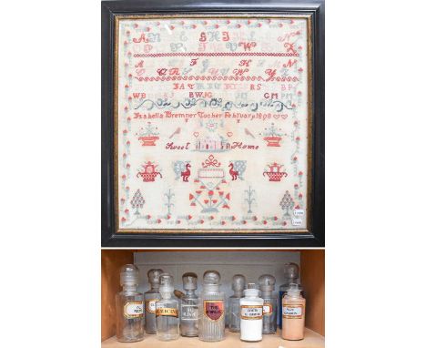 A Late Victorian Woolwork Sampler, worked by Isabella Remner Tocher, February 1898, 62cm by 57cm (framed), together with vari