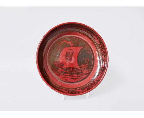 A Bernard Moore Flambe Pottery Bowl, decorated to the centre with a sailing ship under a border of heraldic shields and folia