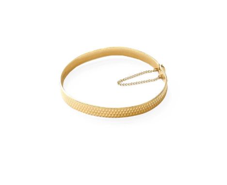 A 9 Carat Gold Bangle, inner measurements 5.6cm by 5.3cm (out of shape)Gross weight 10.7 grams.
