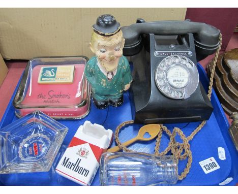 A Circa 1930's Oak Smokers Stand, stepped base, with a tray of smoking memorabilia, telephone, etc.