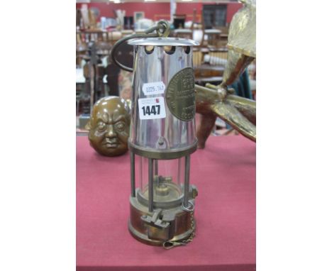 A Eccles Miners Lamp, 24cm high with handle down.