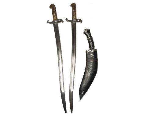 Two French model 1842 bayonets, yataghan type blades, each marked for Chatellerault.1854 and 1855, steel guards and brass gri