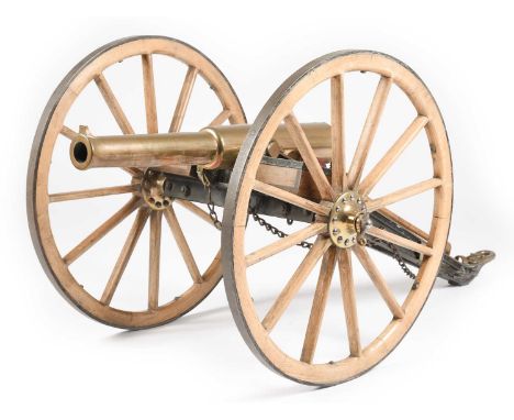 A very good Edwardian cannon, sighted two-stage brass ordnance 26.75 long and of 1.4 in. bore diameter, mounted on a brass fi