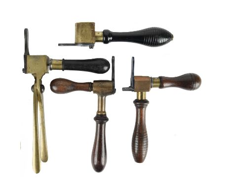 A small collection of vintage shotgun and rifle cartridge loading tools, comprising: a Cocker patent 12 bore combination tool
