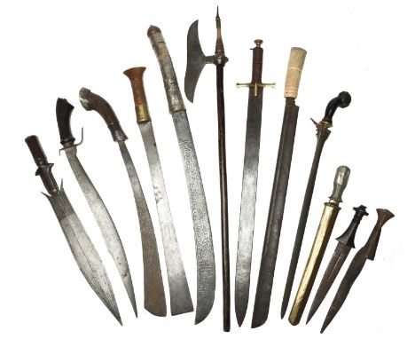 λ A collection of tribal edged weapons, including: a Khond axe (bulova), iron head with double-crescent blade and striking ri