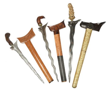 A Malay dagger (kris), flamboyant watered steel blade 17.25 in., ornate gilded and gem-set hilt in the form of a Raksasa, har