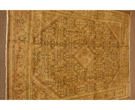 Large Persian carpet, stepped lozenge medallion and spandrels, decorated with Herati motifs, 400cm x 300cm   Condition Report