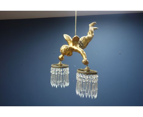 Gilt metal centre light fitting in the form of a cherub, twin branch with cut glass hanging drops, H42cm    Condition Report 