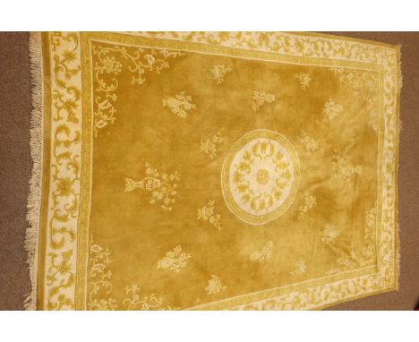 Chinese washed woollen gold ground carpet, decorated with tailing foliage. centre shou motif, 363cm x 267cm   Condition Repor