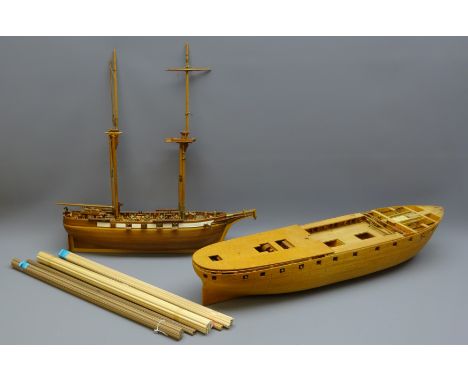 Two wooden 1:46 approx scale part finished kit models, one of a twin masted cargo ship, the other planked on frame, both de-r